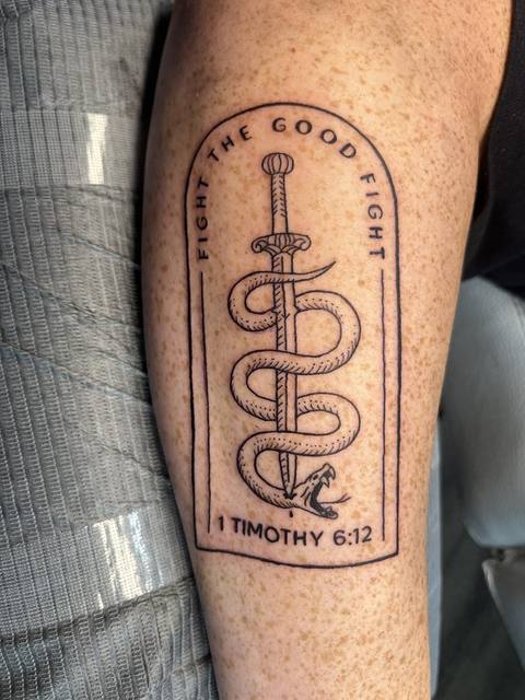 Fine line dagger and snake on a forearm