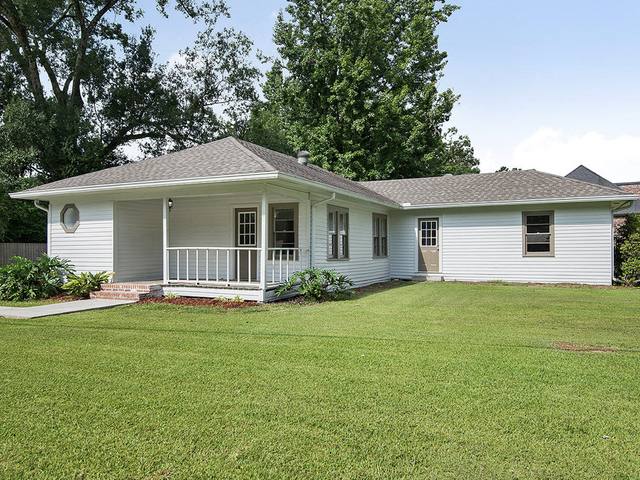 The shop, a white house with a front porch on LA-16